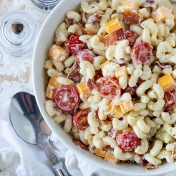 pasta salad in white bowl on table.
