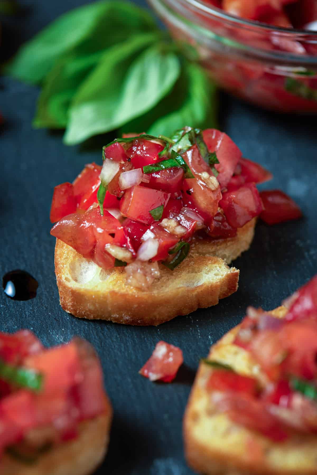 diced tomatoes on crostini with balsamic glaze.