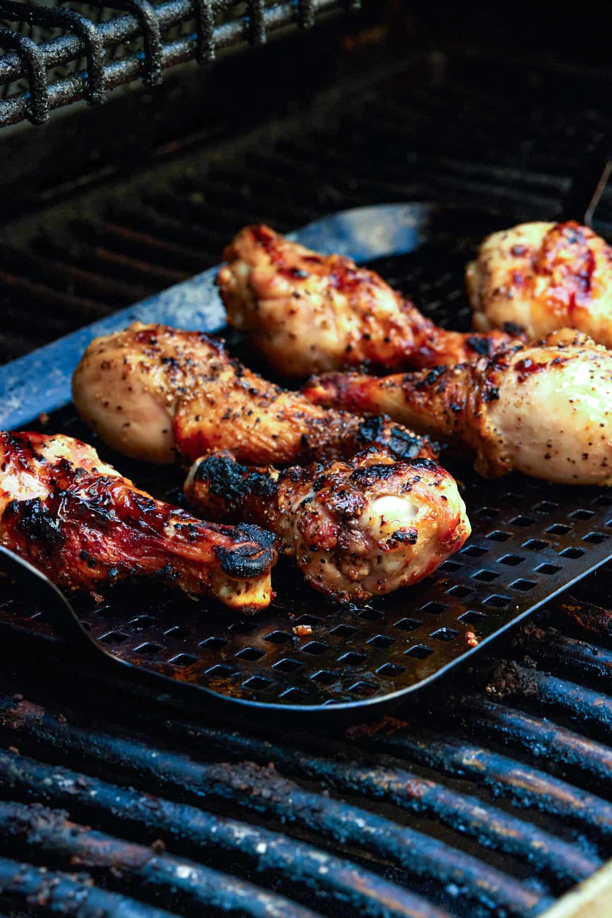 Chicken legs on grill.