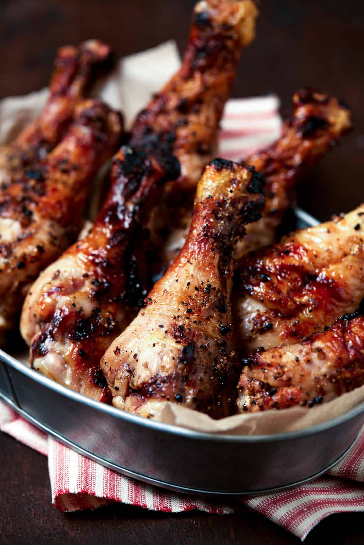 grilled chicken drummies in serving bowl.