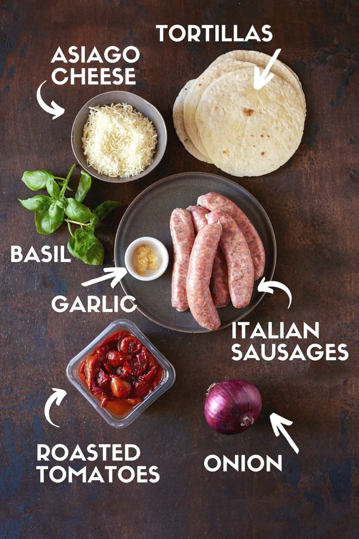 Ingredients for Italian Grilled Sausages, including sausages, roasted tomatoes and tortillas. 