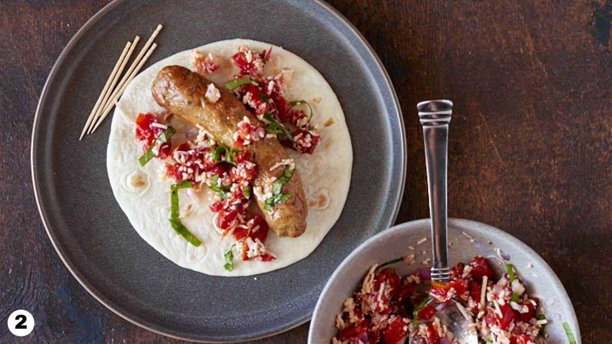 Italian sausage topped with tomato bruschetta on a tortilla. 