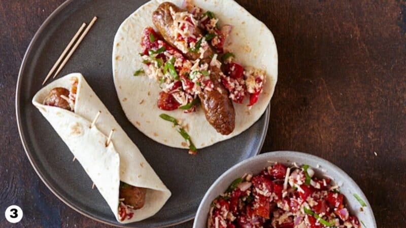 Italian sausages topped with tomato bruschetta mixture and rolled into a tortilla.