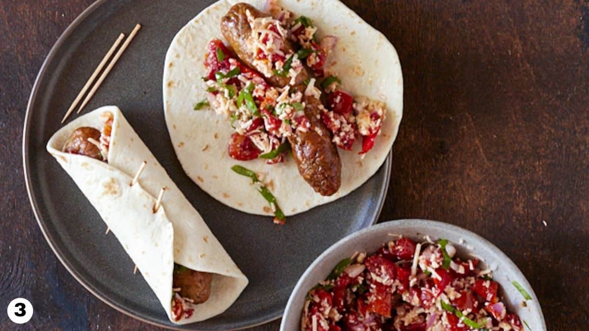 Italian sausages rolled in tortillas and secured with toothpicks. 