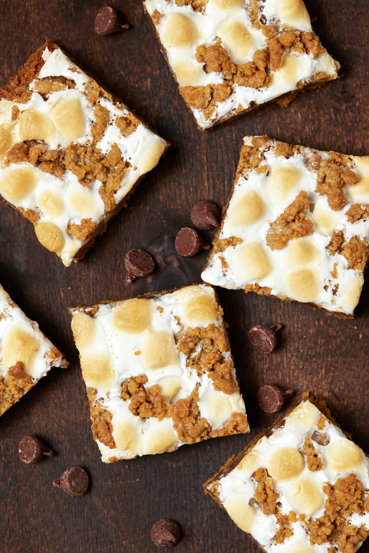 Baked s'mores bars on a wood board. 