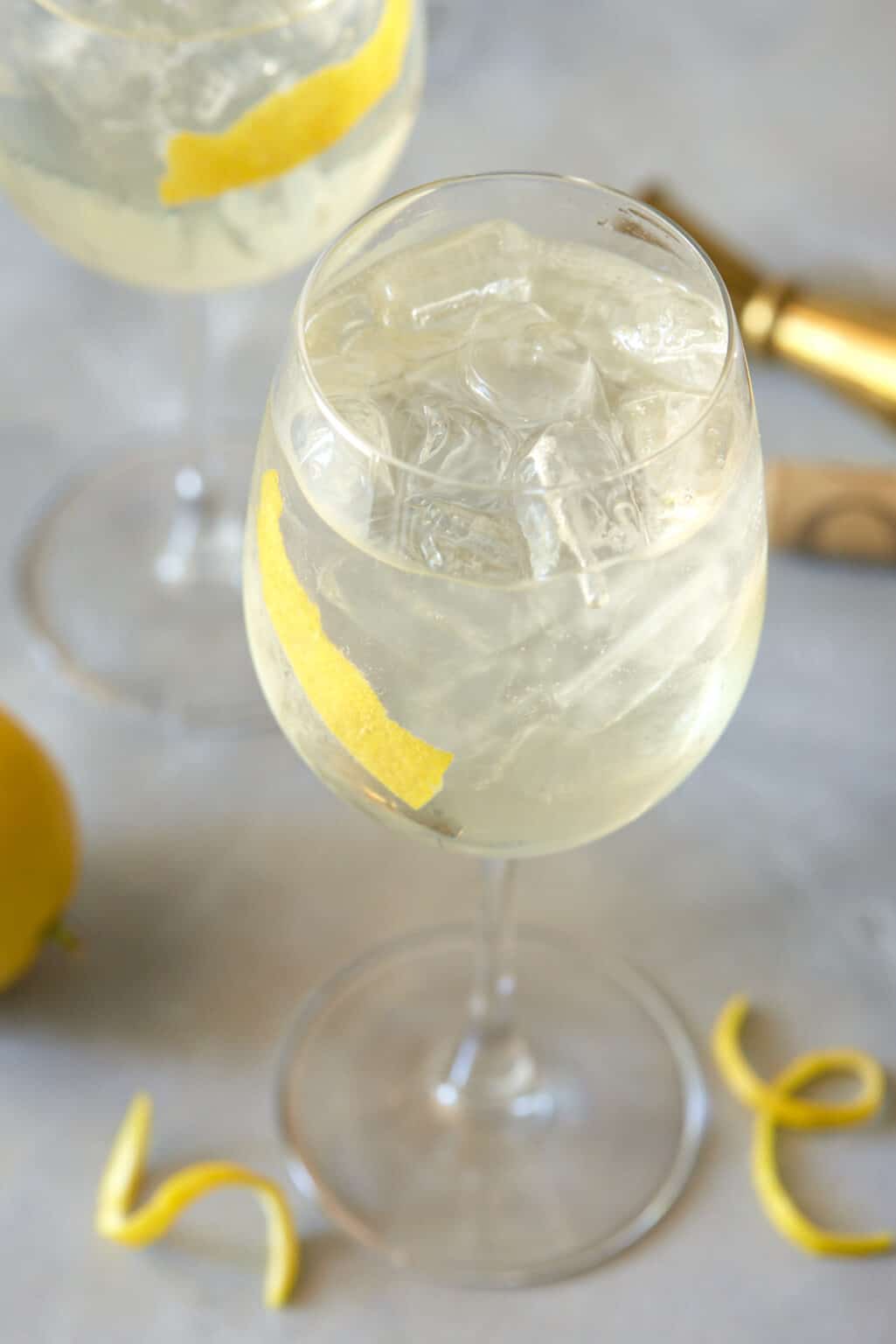 White Wine Spritzer with Elderflower Garnish with Lemon