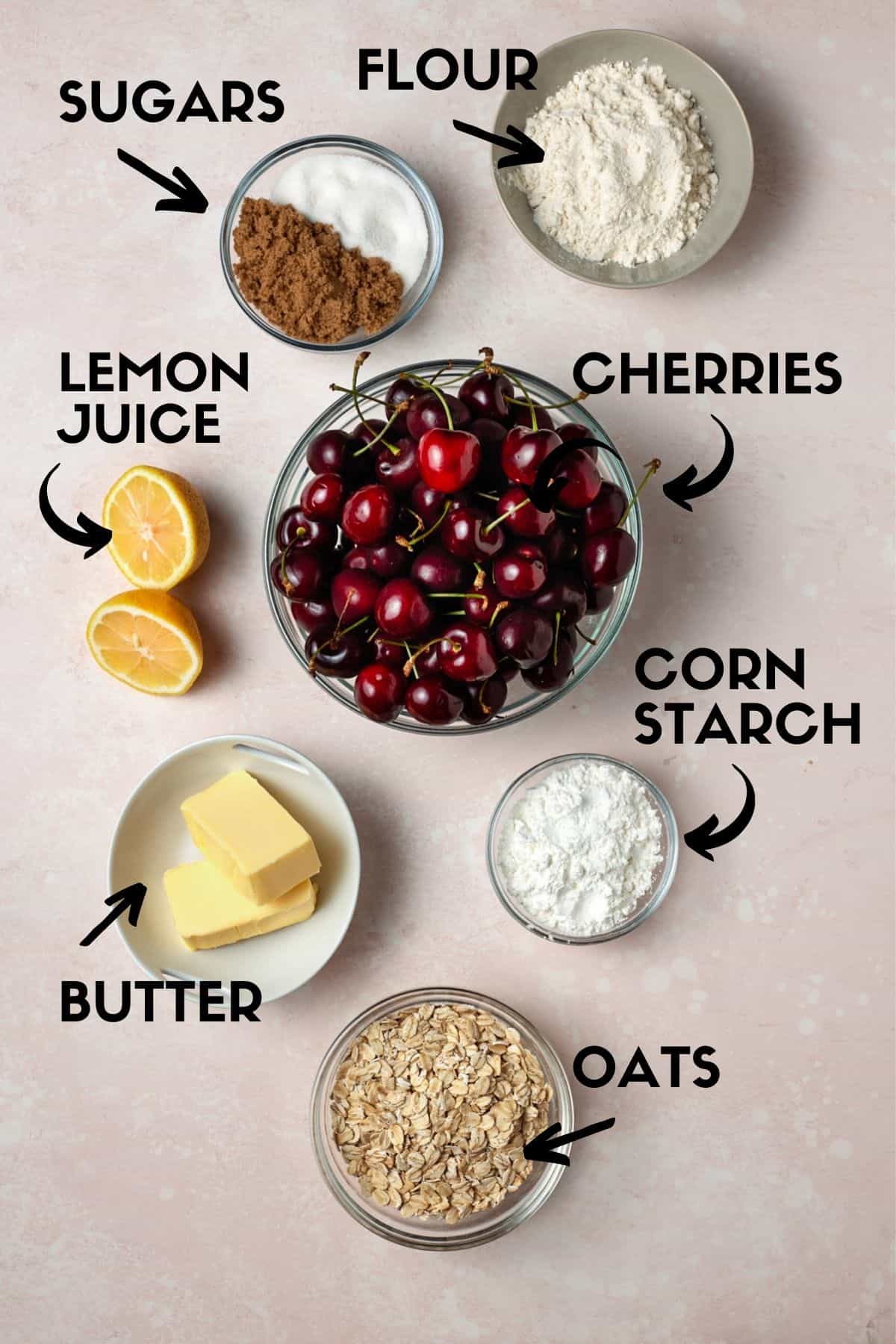 Ingredients for cherry crisp, including fresh cherries, butter, oats, sugar and corn starch. 