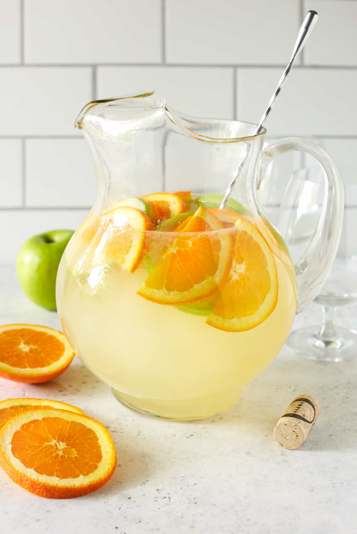 pitcher filled with lemonade and fresh fruit slices.