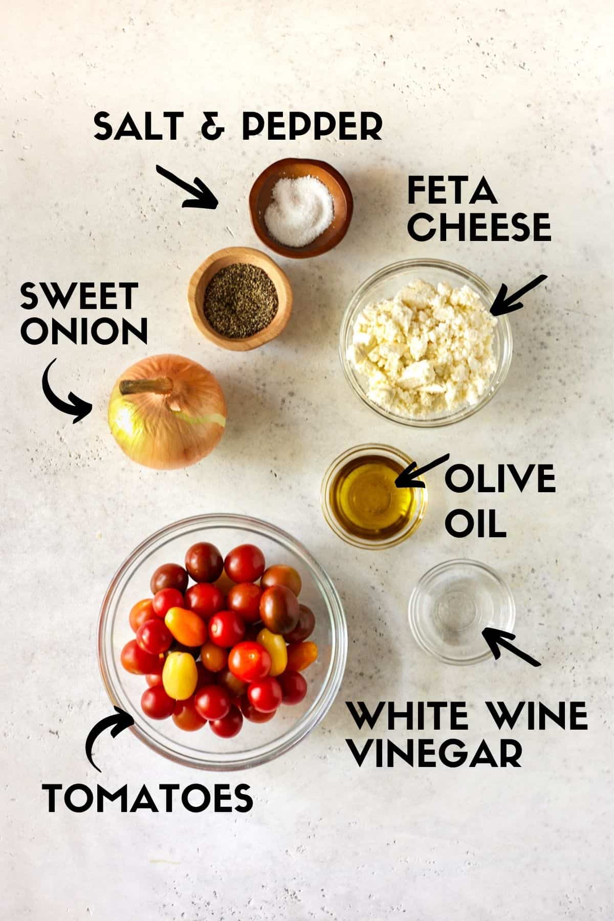 Ingredients for Cherry Tomato Salad including tomatoes, onion, feta cheese and vinegar. 