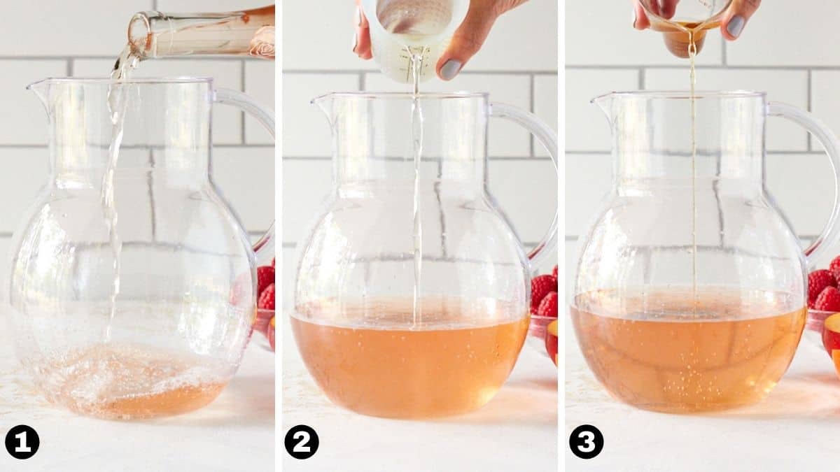 Hand pouring rosé wine, elderflower liqueur and brandy into a pitcher. 