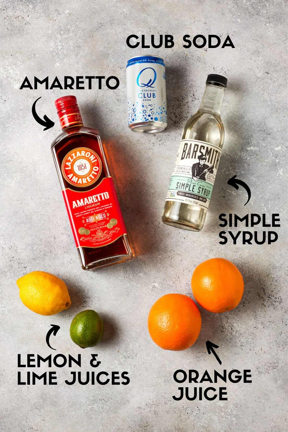 Bottle of amaretto, citrus fruits, simple syrup and club soda. 