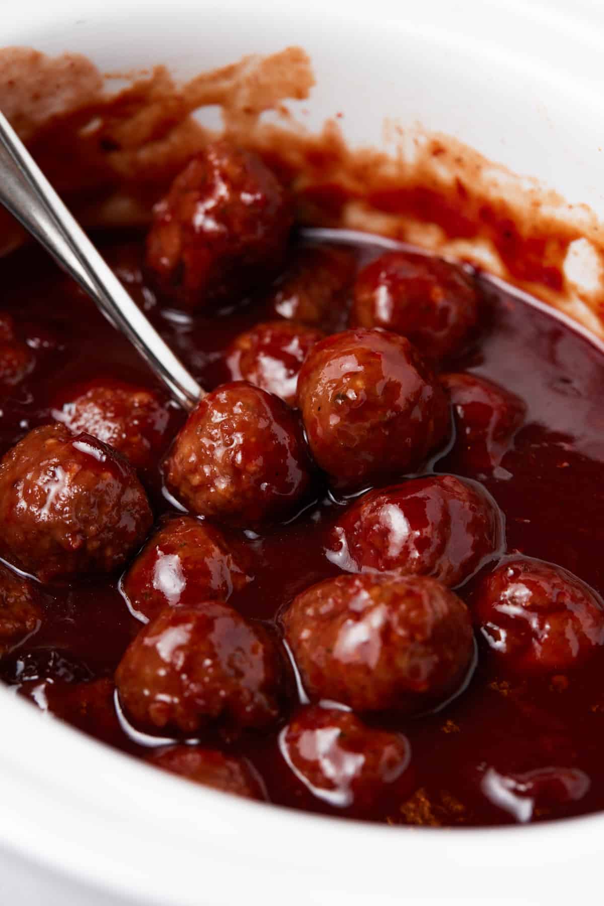 Meatballs in barbecue sauce in slow cooker.