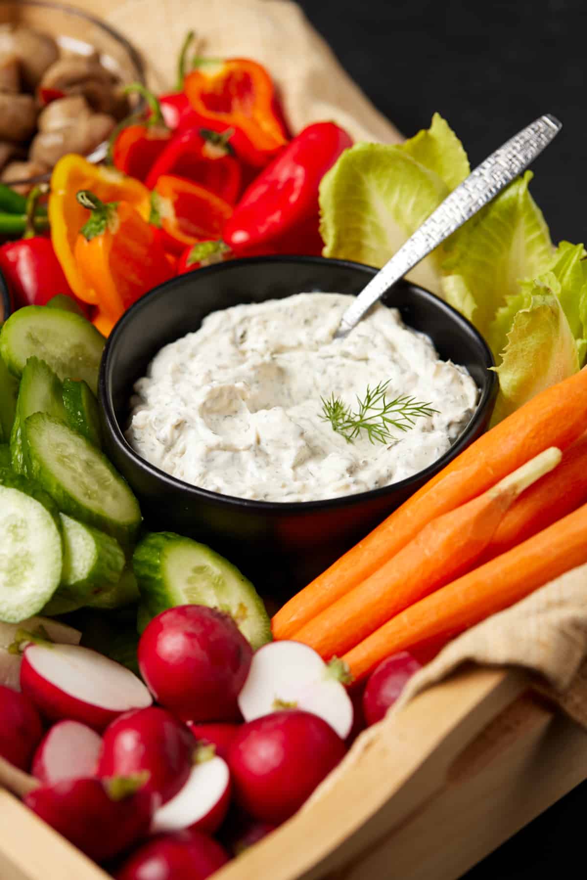 Dip in bowl with sliced fresh veggies.