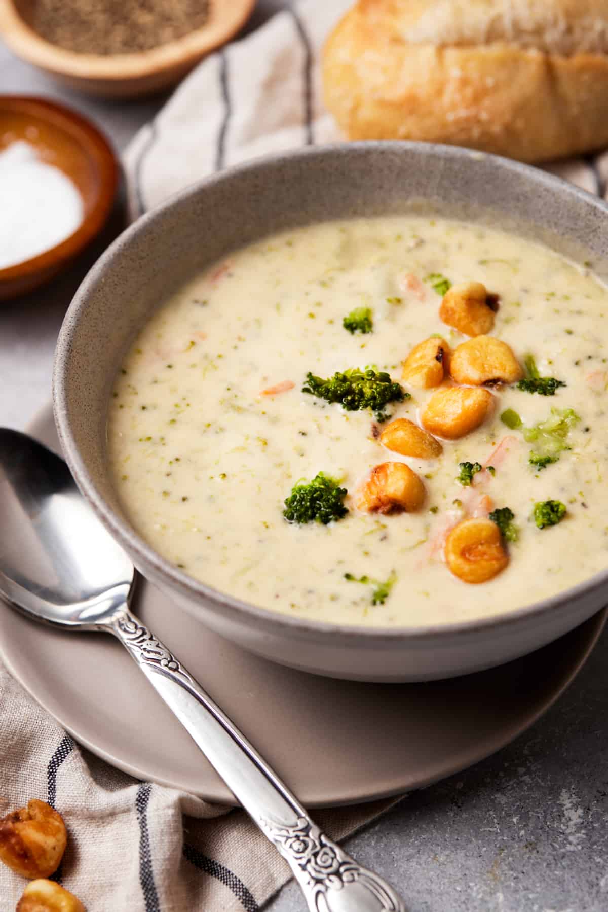 Broccoli Cheddar soup in bowl with corn nuts.