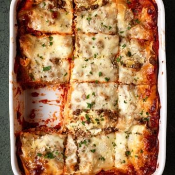 lasagna in white baking dish.