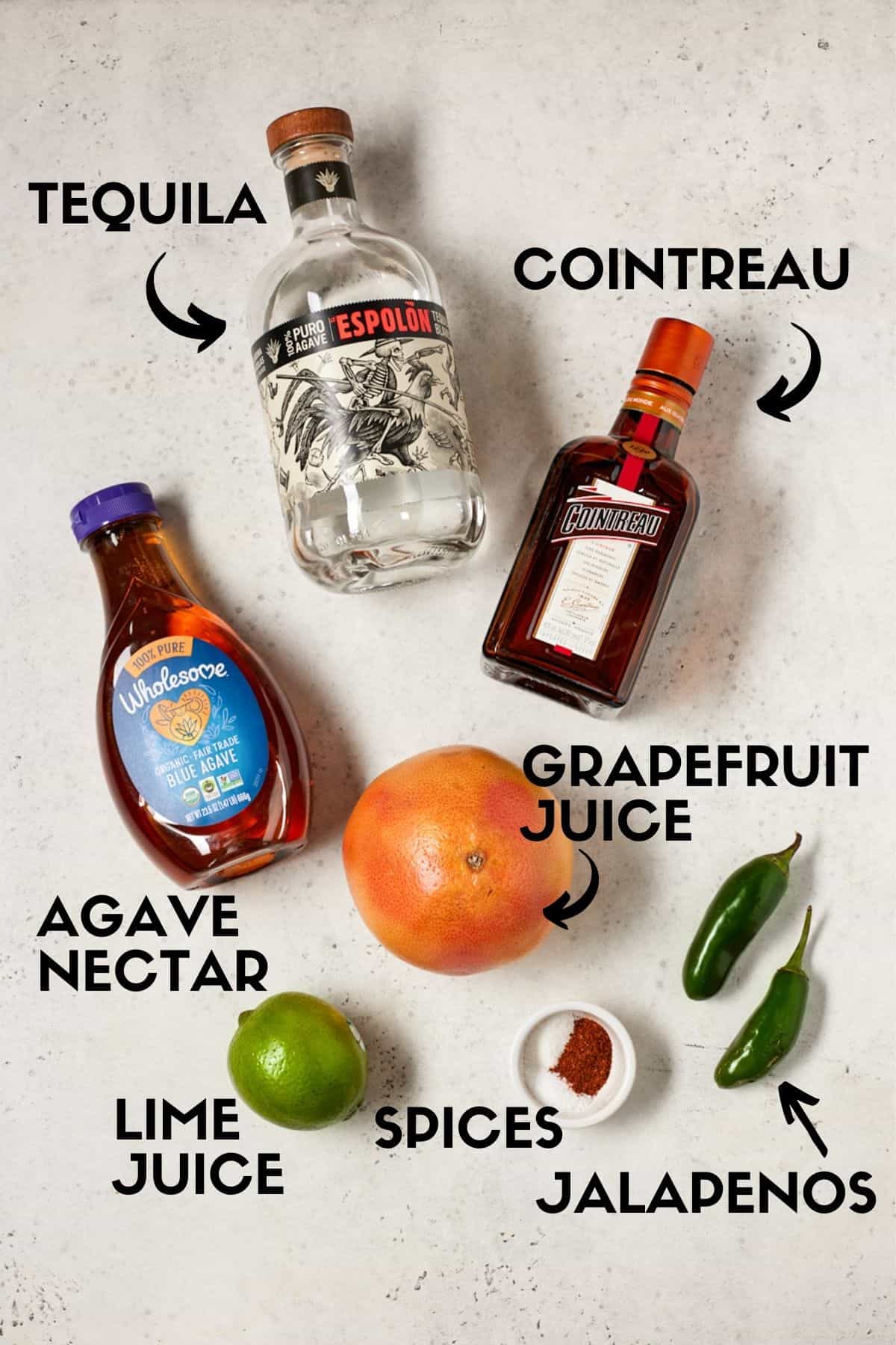 Grapefruit margarita ingredients including tequila, cointreau and grapefruit juice. 