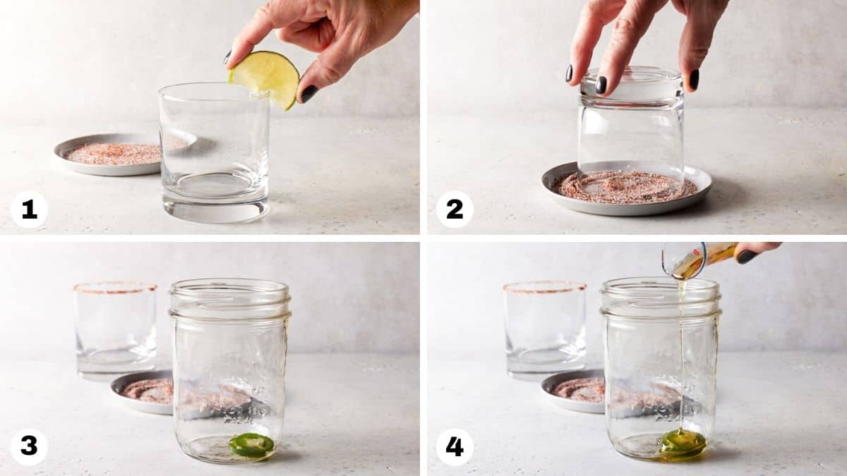 Hand rimming lowball glass with lime and jalapeno slices in a mason jar. 