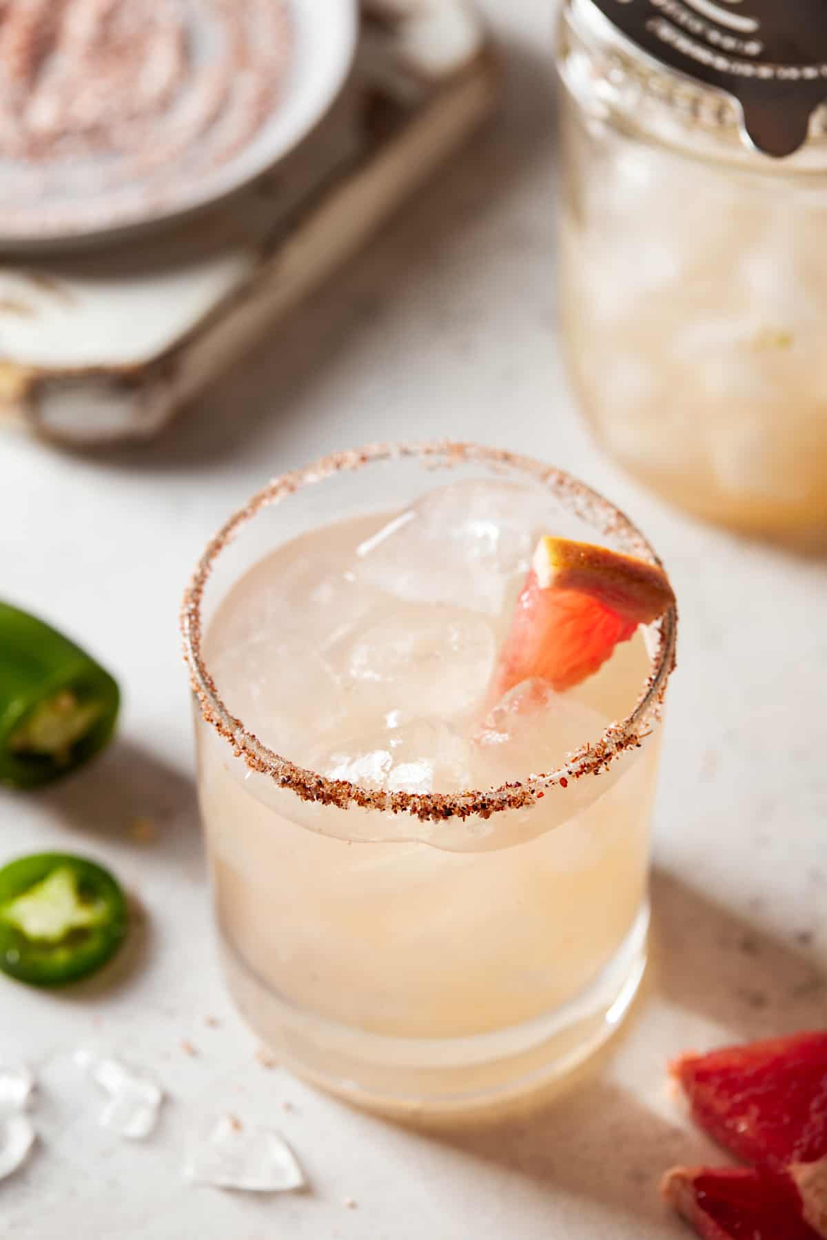 Grapefruit margarita in a chili rimmed lowball glass. 