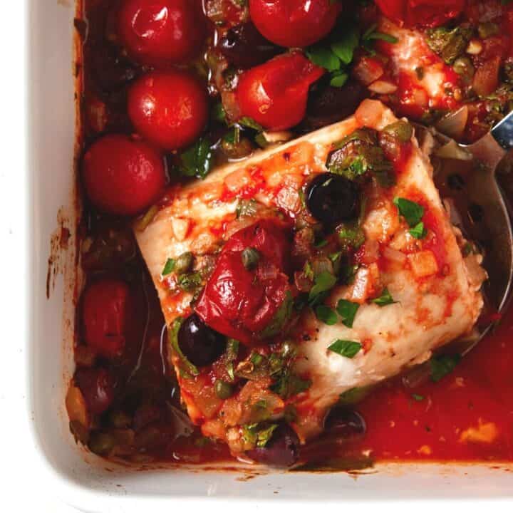 Baked Mahi Mahi Recipe with Tomatoes & Olives Garnish with Lemon