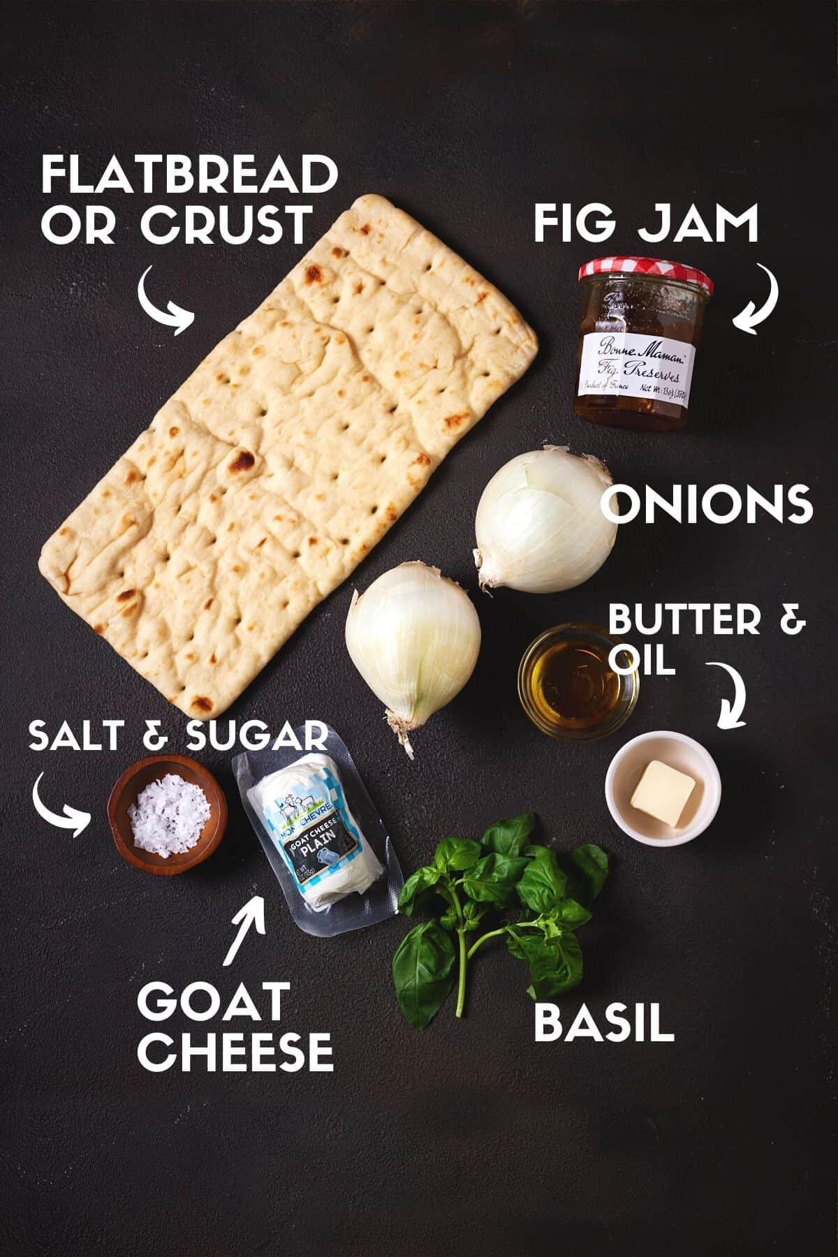 Ingredients for goat cheese pizza including goat cheese, flatbread, basil, onions & fig jam. 