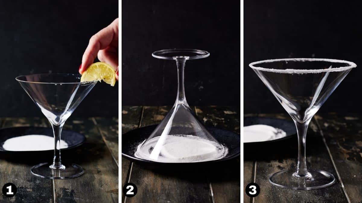Martini glass being rimmed with a lemon wedge and dipped in sugar.