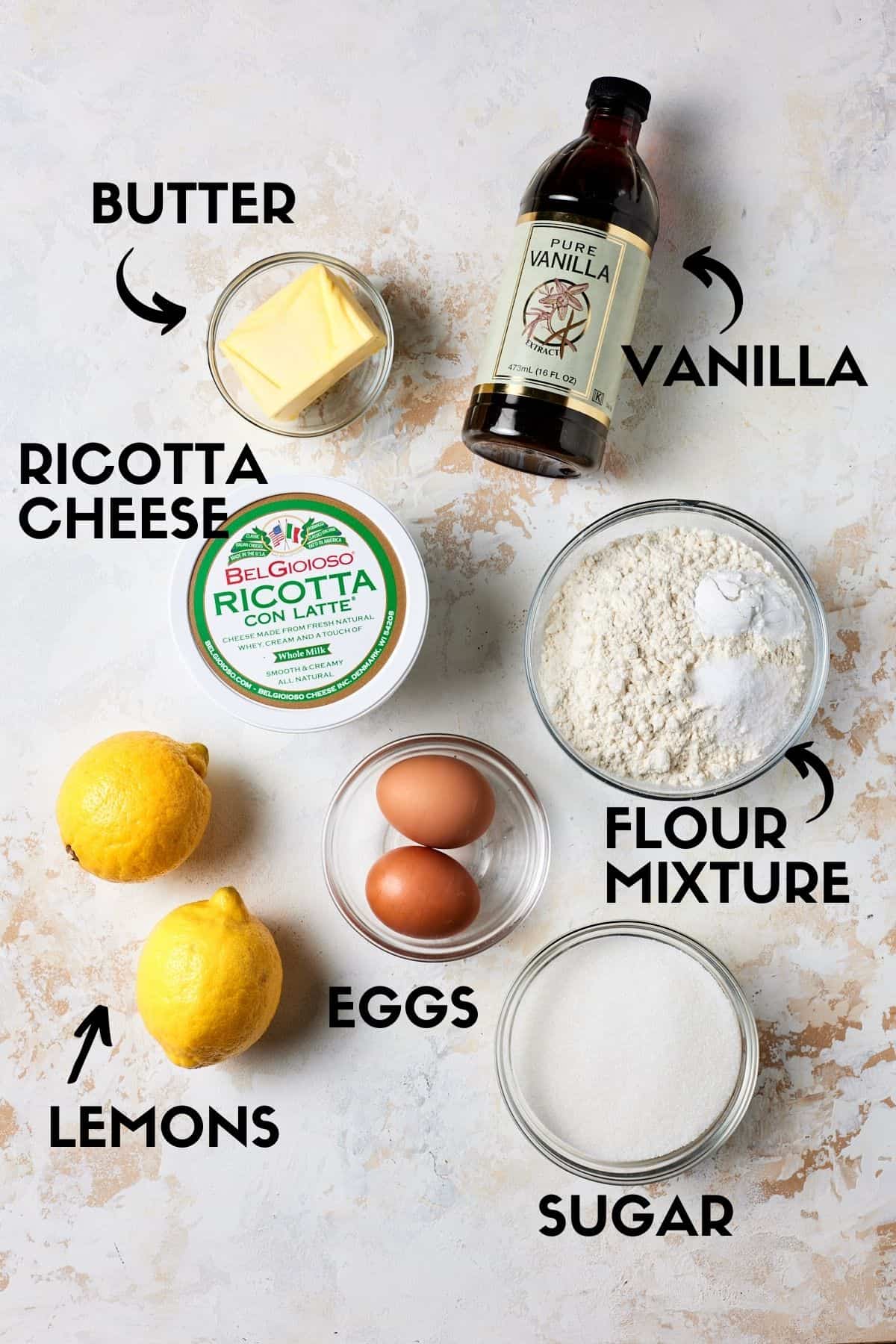 Lemon Ricotta Cake ingredients including eggs, flour, ricotta cheese and sugar. 