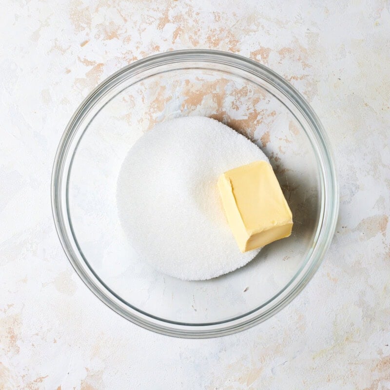 Butter and sugar in a glass bowl. 