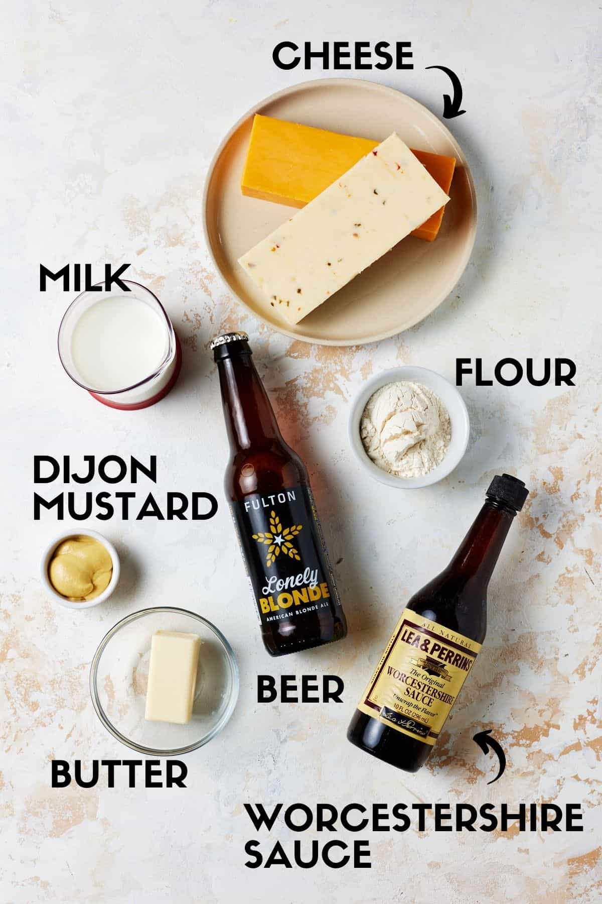 Ingredients needed for pretzel cheese dip, including cheese, beer, milk, flour & butter. 