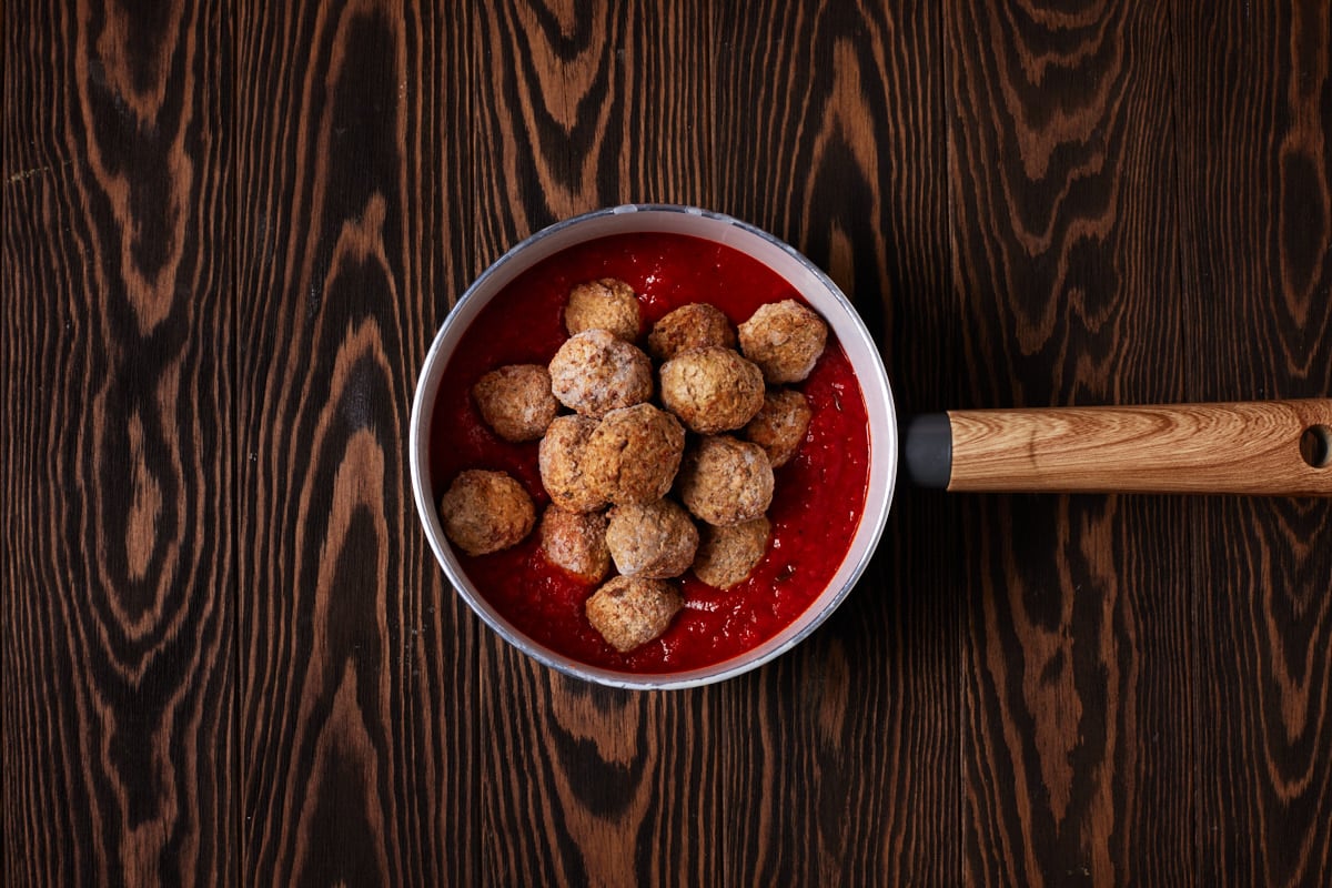 Meatballs and marinara in a saucepan. 