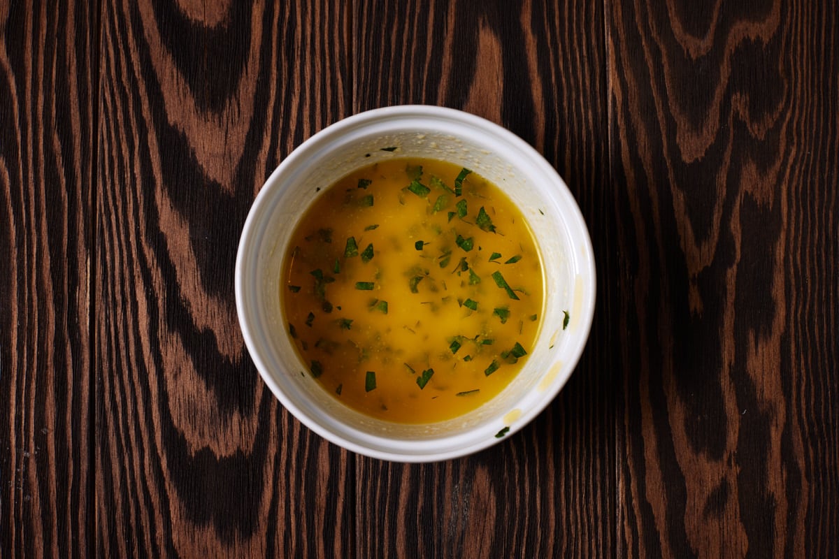 Melted garlic butter in a white ramekin. 