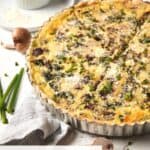 Spinach quiche with fresh mushrooms and cheese.