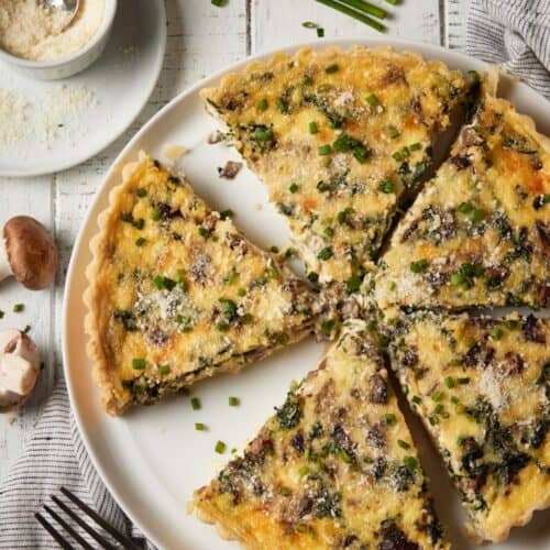 sliced spinach quiche with parmesan cheese.