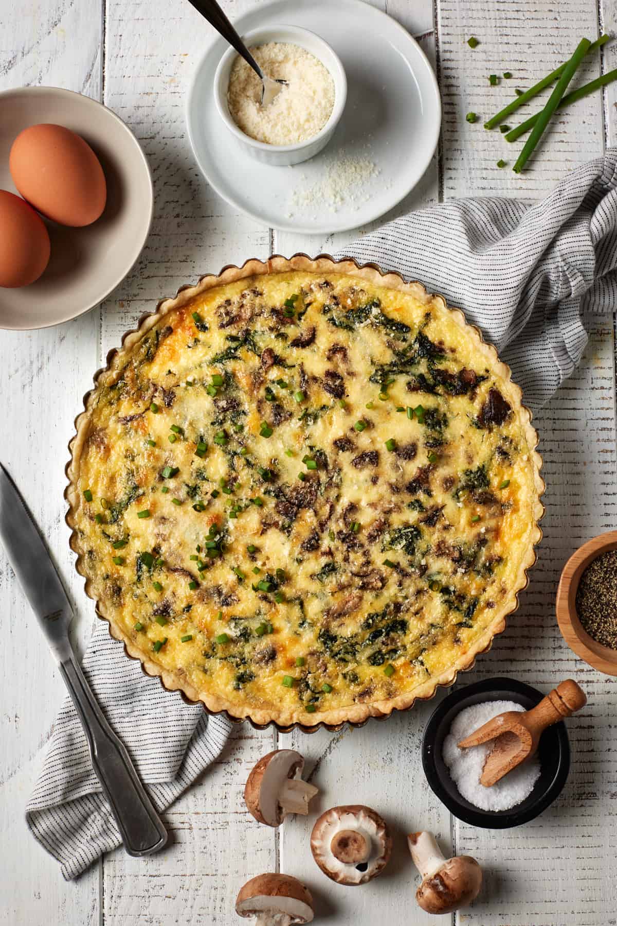 Baked quiche in pan with parmesan cheese and eggs.