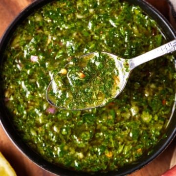 chimichurri in small bowl with spoon.