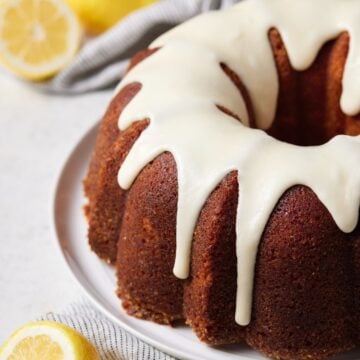 Lemon bundt cake on white plate.