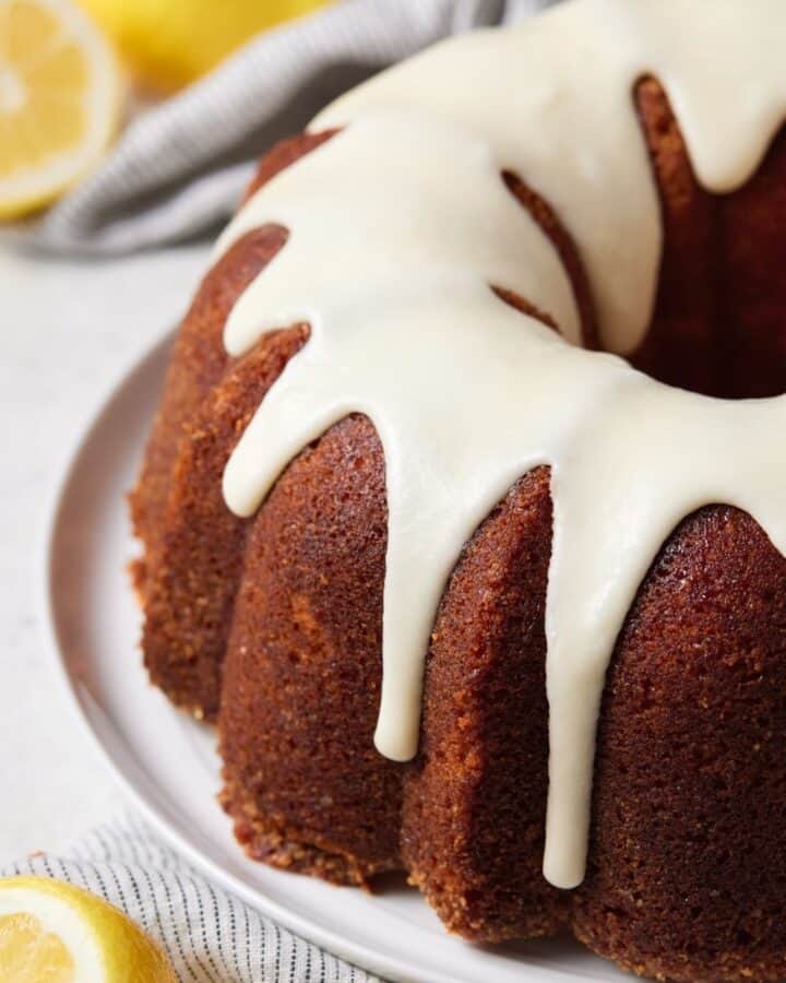 Lemon bundt cake on white plate.