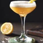 Rum sour in coupe glass with lemon peel.