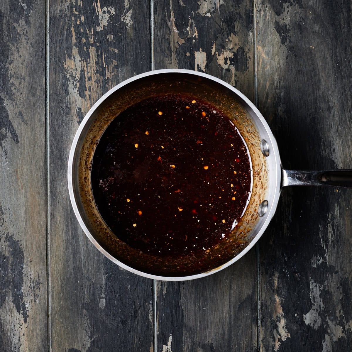 Maple ginger glaze in a metal saucepan. 