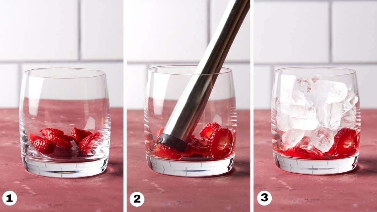 3 lowball glasses with muddled strawberries and ice. 