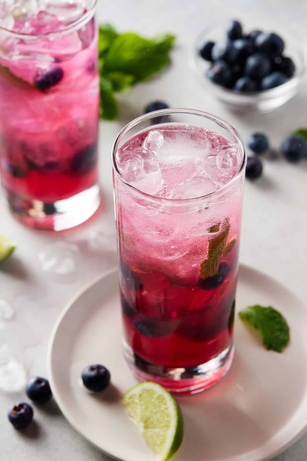 Mojitos with blueberry and mint.