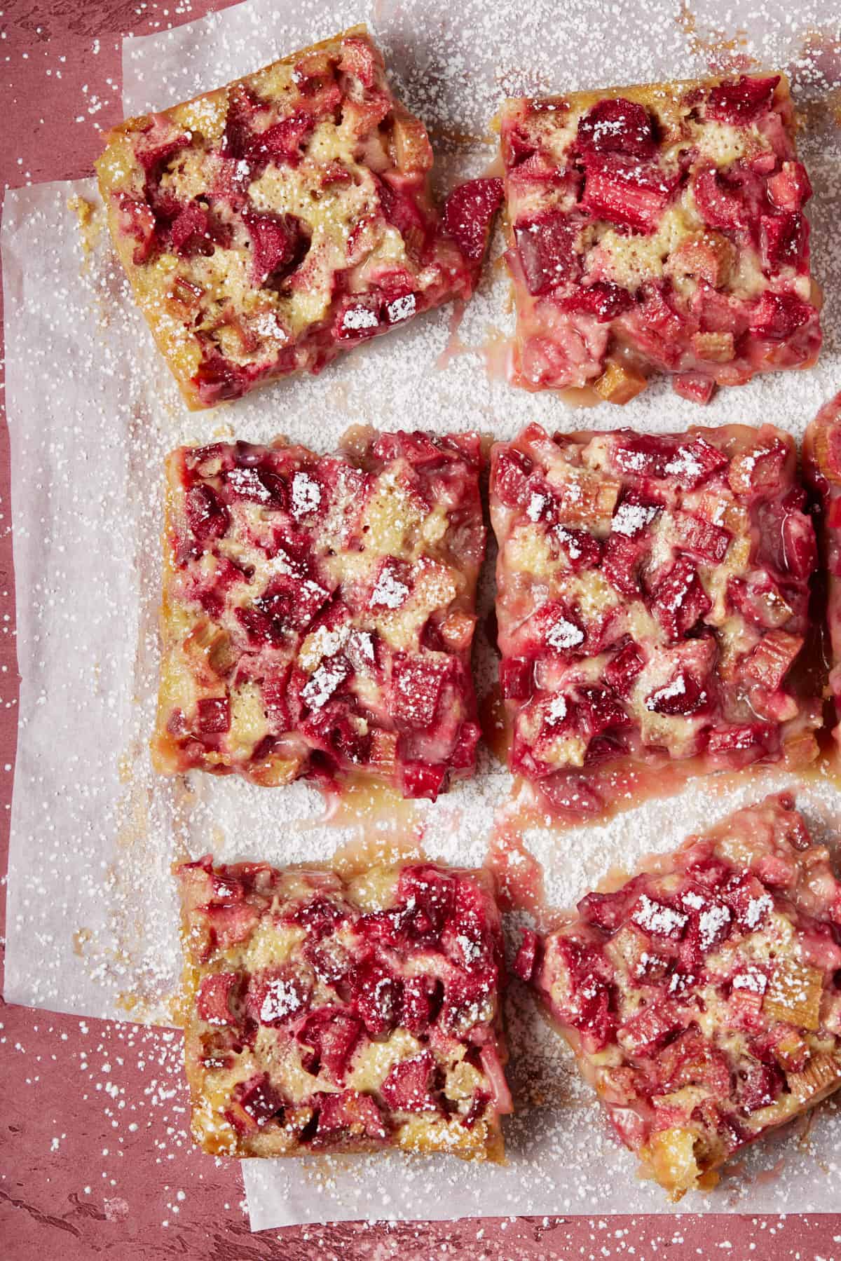 Rhubarb bars dusted with powdered sugar.