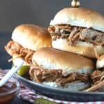 pile of pulled pork sandiwches.