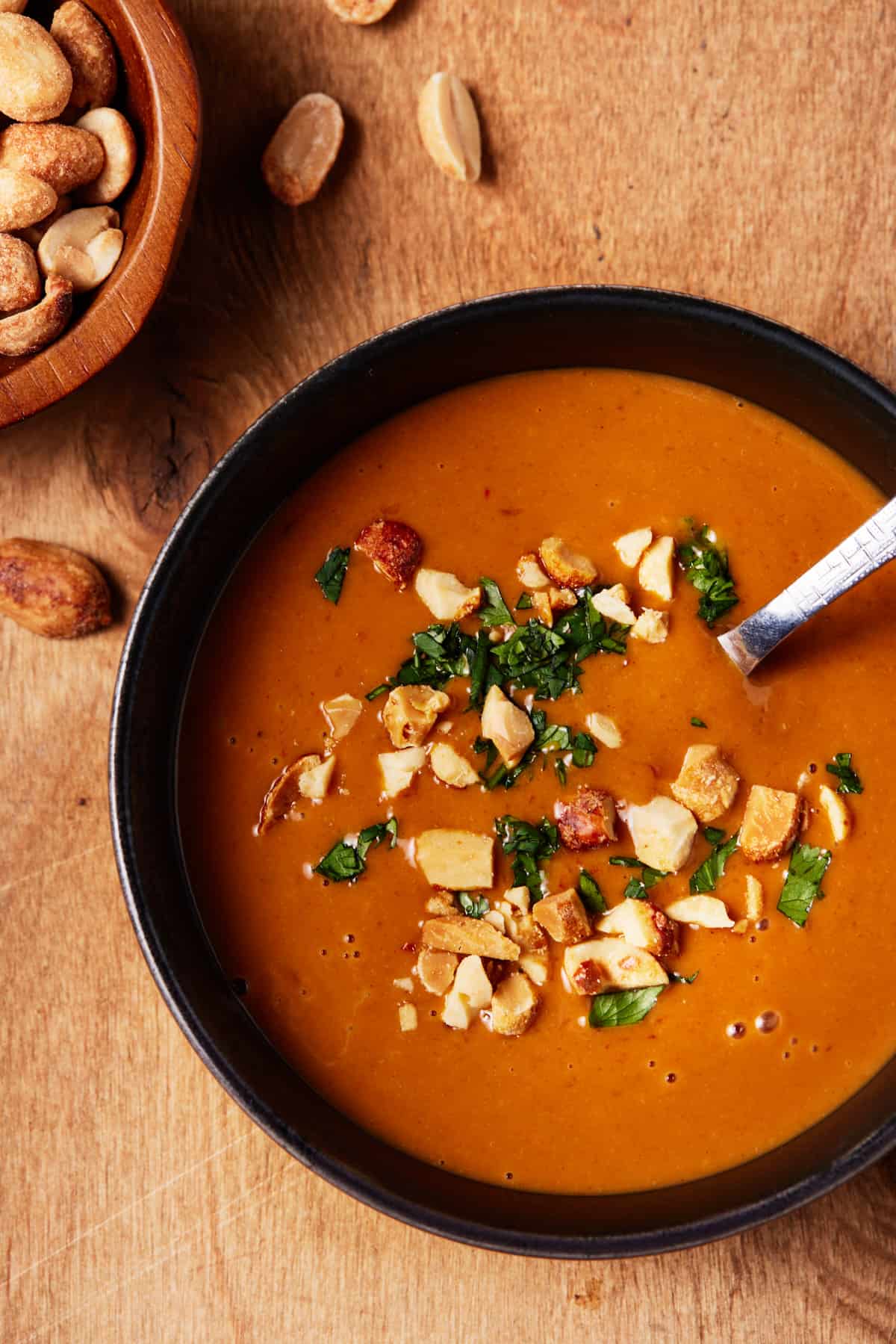 Peanut sauce in a bowl with fresh cilantro.