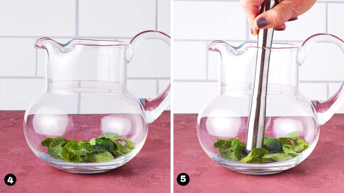 Fresh mint leaves being muddled in pitcher.