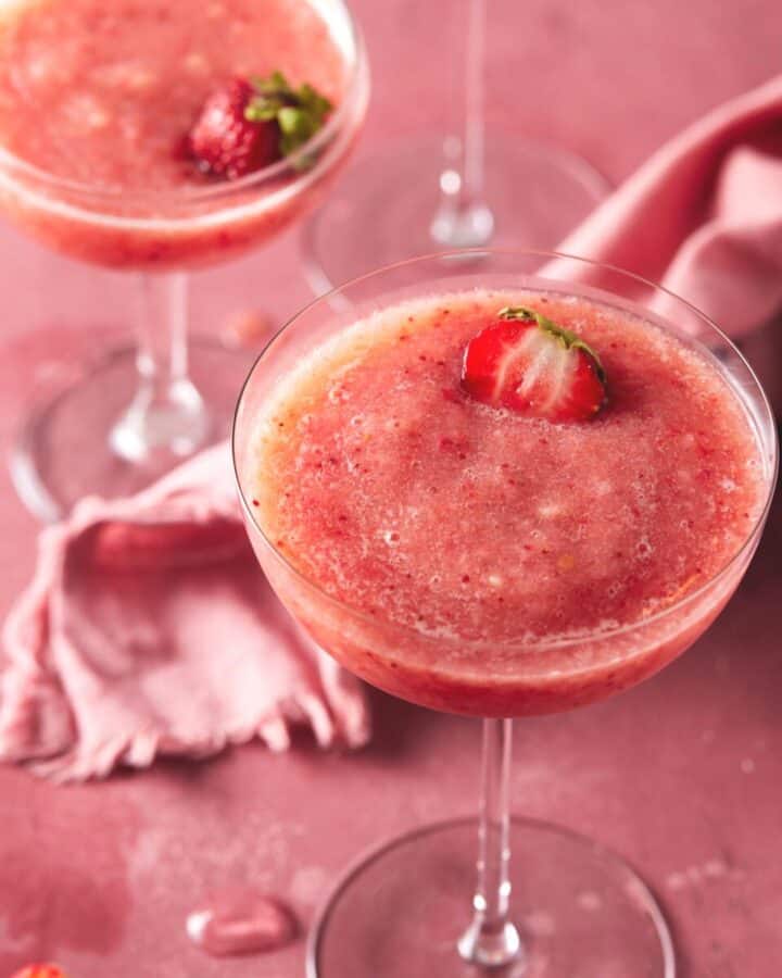 frozen rose in glasses with a strawberry garnish.