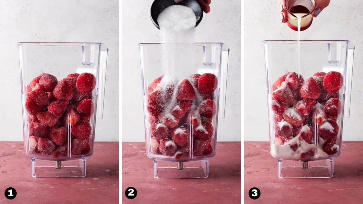 Blender jar filled with frozen strawberries, sugar and lemon juice.