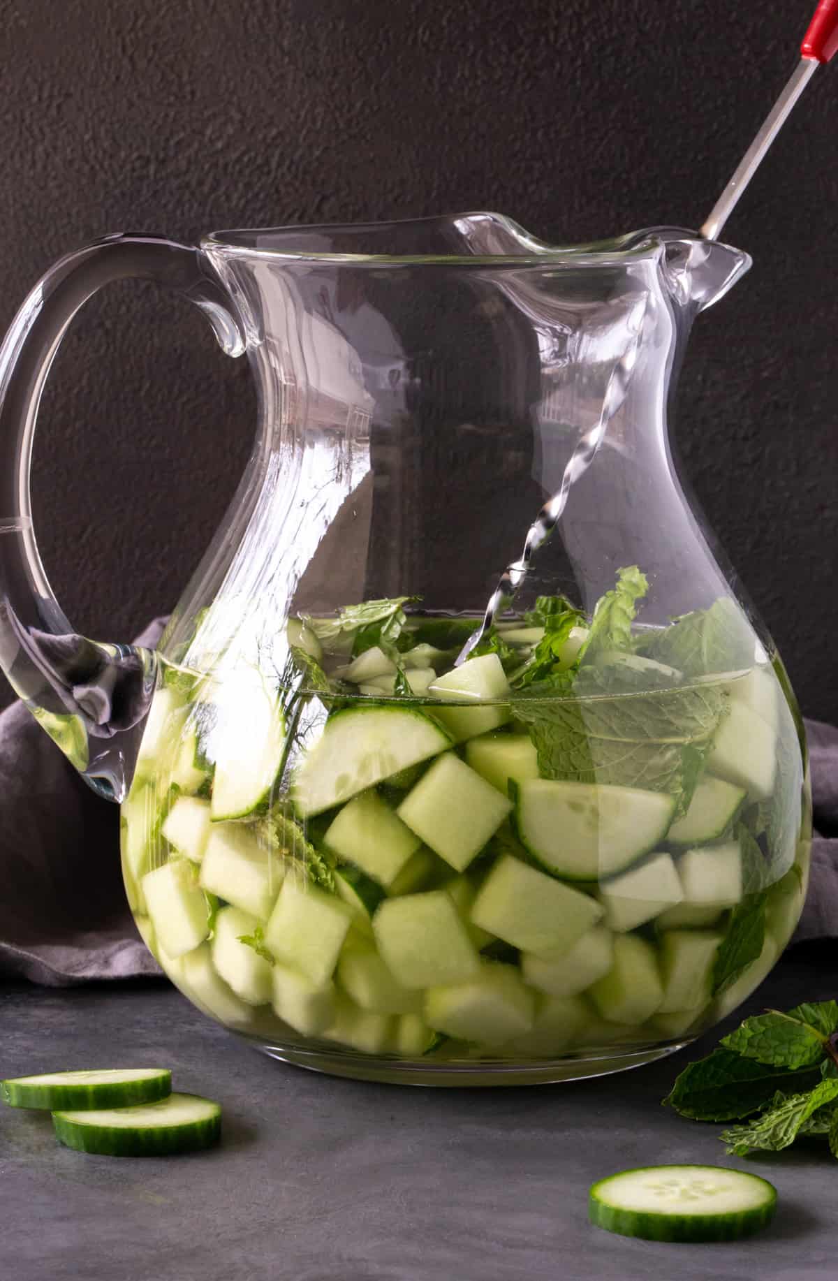 Pitcher of spa water sangria with cucumber, honeydew melon and mint. 