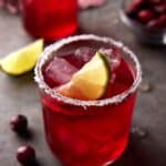 Cranberry margaritas with limes and salted rims.