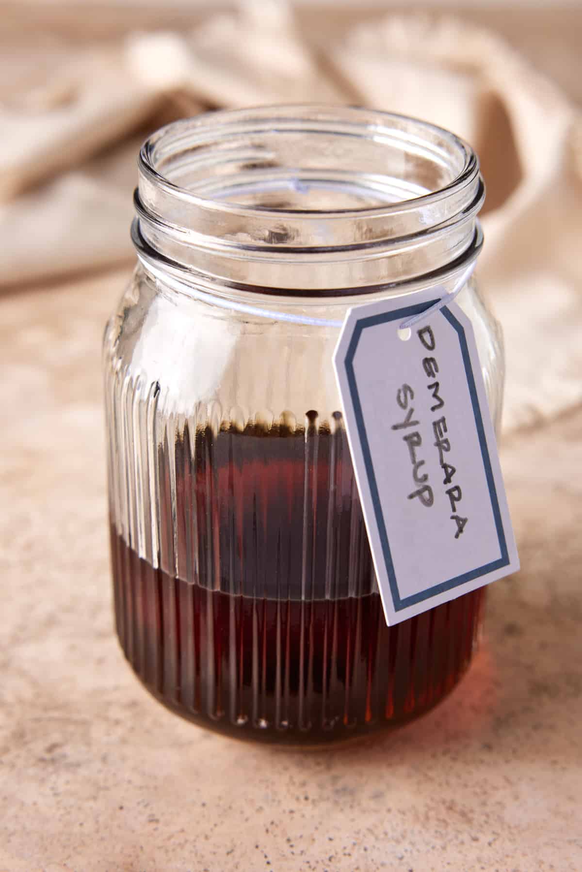 Demerara syrup in mason jar with label.