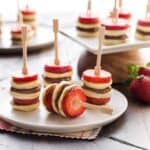 Mini pancake skewers with sliced strawberries and Nutella.